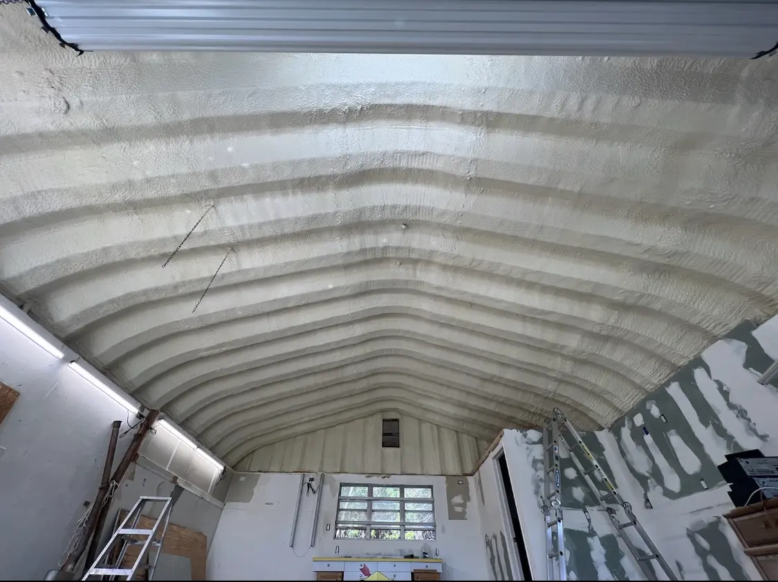 Spray polyurethane foam applied to the underside of a metal roof deck in Hilo